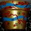 gold tribal design flower pot